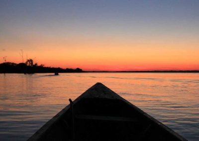 Amazon tour highlight - take in the Amazon river sunset by canoe on our jungle tours peru